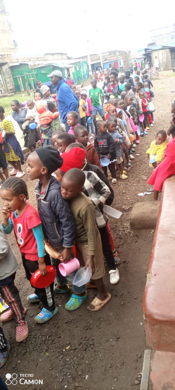 Children waiting in line for food distribution